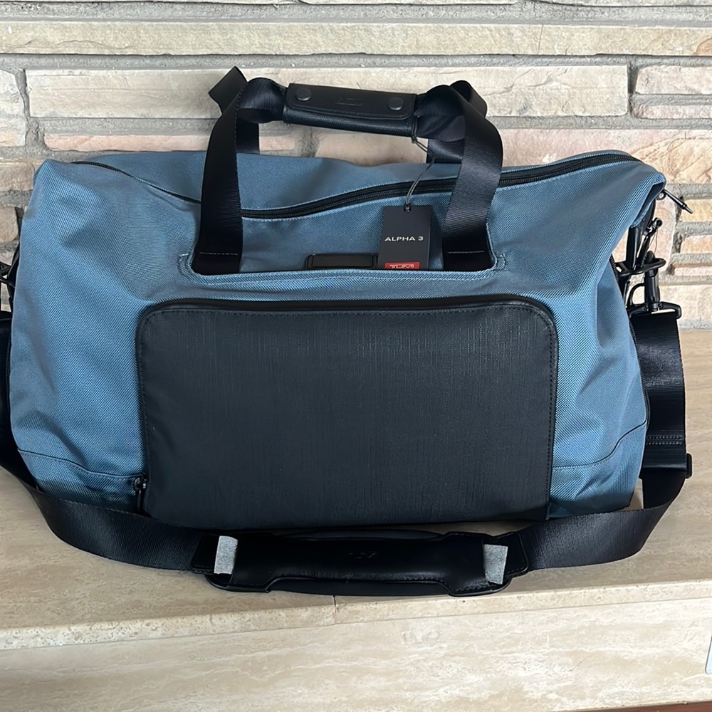 Tumi alpha 3 double expansion travel satchel. Never been used.